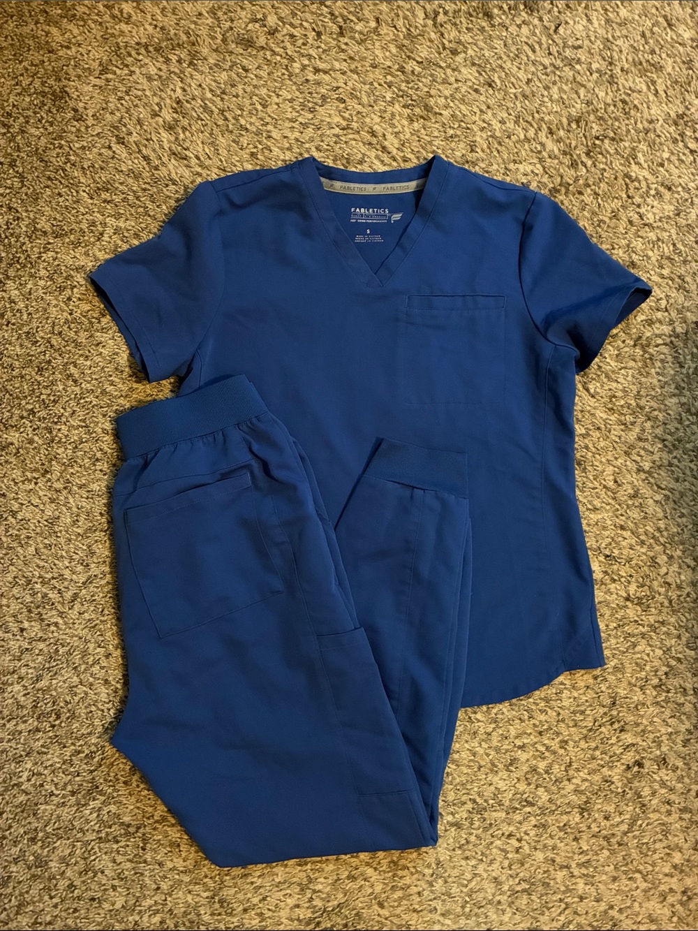Fabletics scrub set with one pocket top and joggers in royal blue